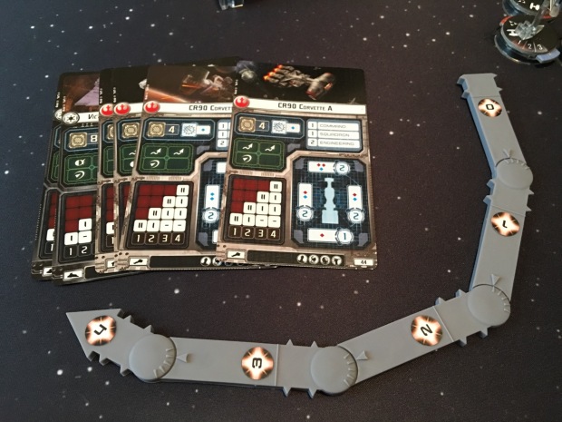 Ship cards and the movement template. There is only one template, unlike the many in X-Wing, but it is a bit more complicated.